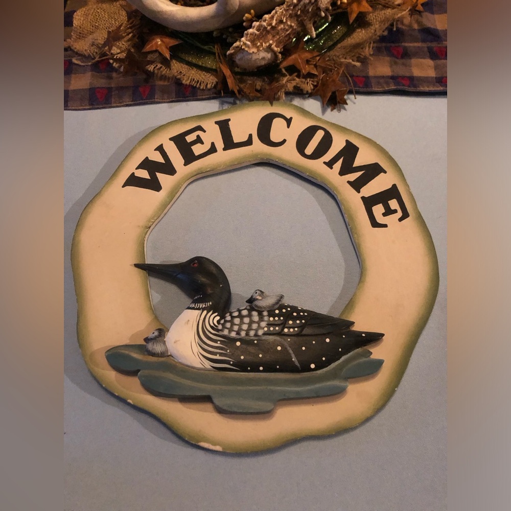 Welcome sign with ducks